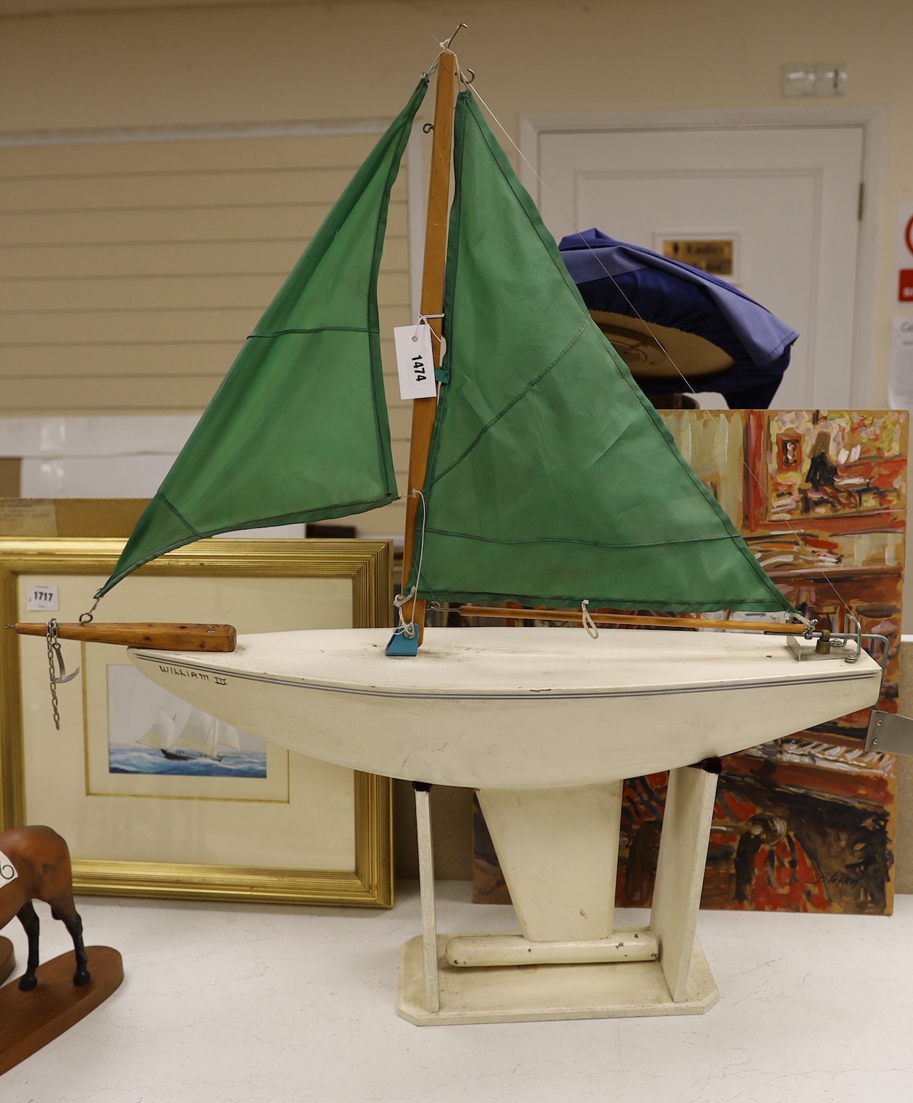 A pond yacht with stand, 100cms wide x 100cms high.